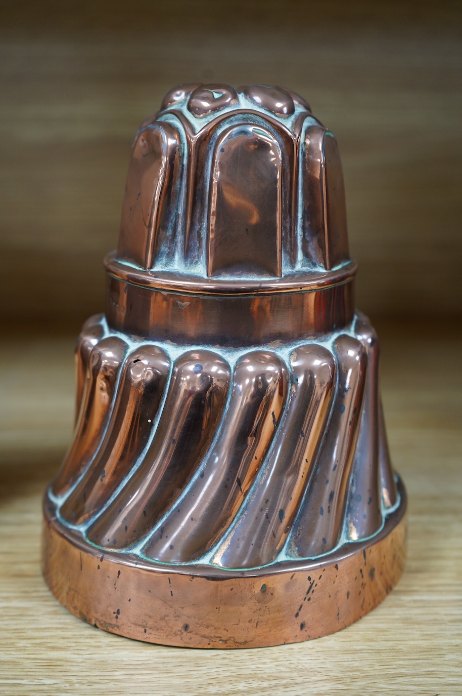 A tall Victorian copper jelly mould, 17cm. Condition - fair